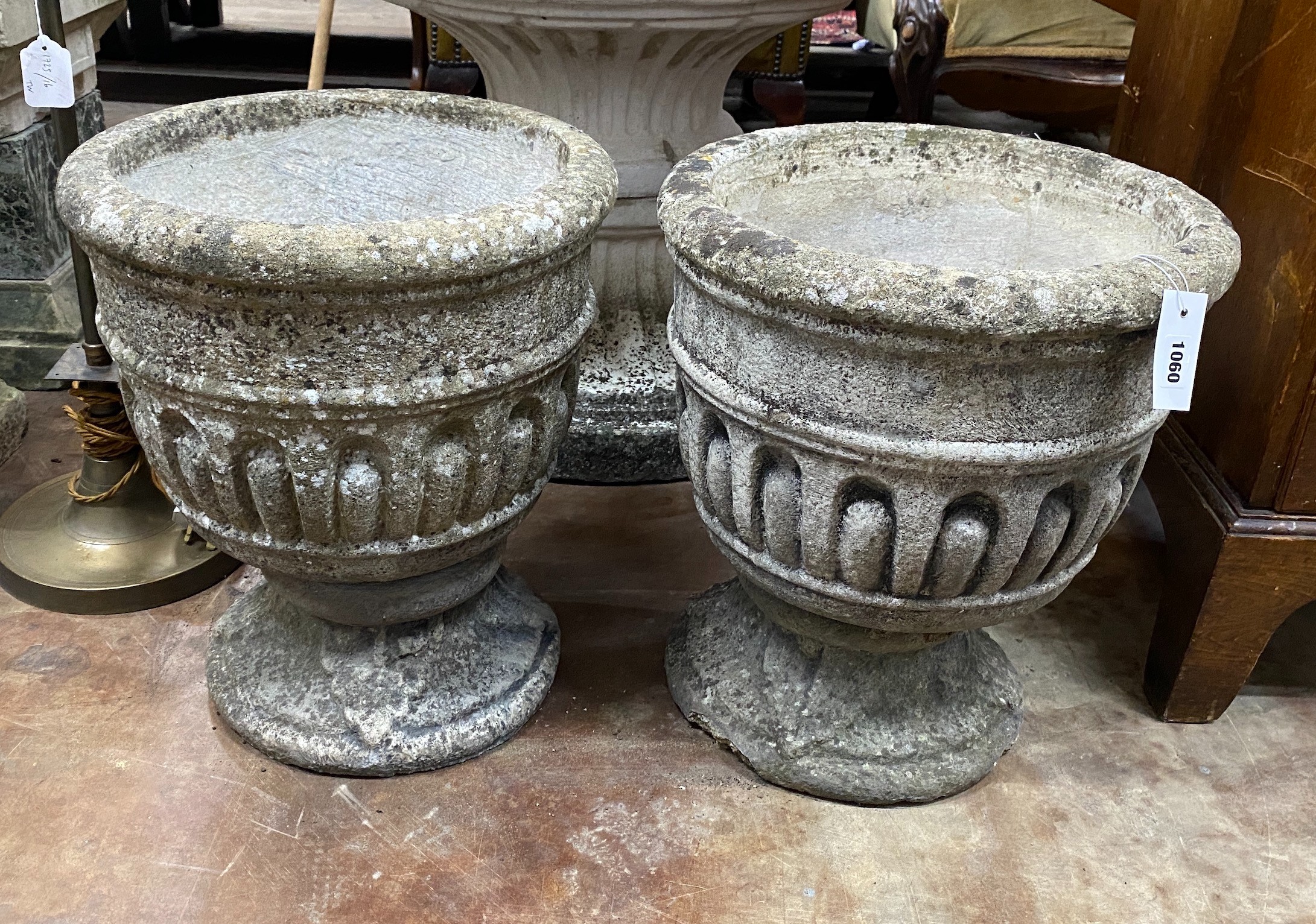 A pair of circular reconstituted stone garden planters, diameter 39cm, height 44cm